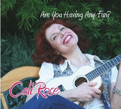 front cover of album features Cali playing ukulele while sitting on a bench and smiling