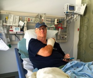 Recovery Room after Craig's surgery.  Cell phone attached to hand.