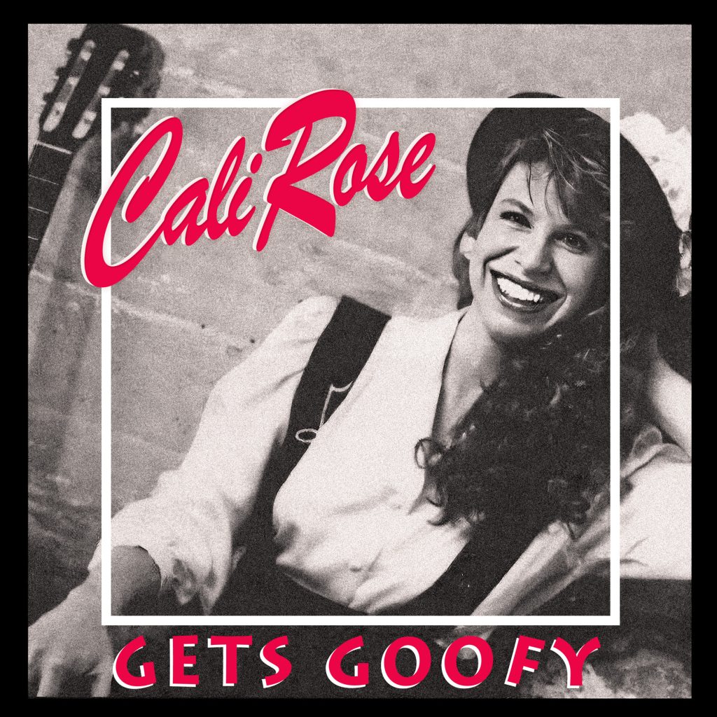 A CD cover with a black and white photo of a woman with long hair wearing a white blouse and dark suspenders and a hat.